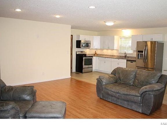 Ceiling can lights add extra ambiance to this fabulous space.  Perfect for everyday living as well as entertaining.