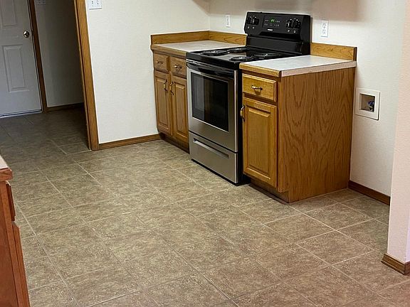 kitchen looking towards laundry room and pantry closet