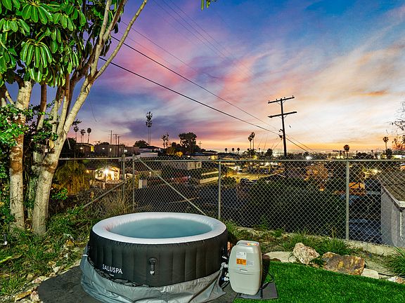 Unwind in the hot tub while enjoying a stunning view.
