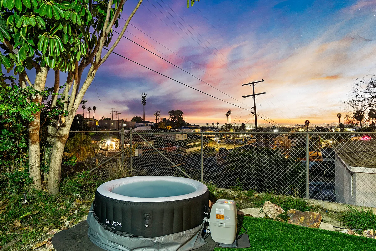 Unwind in the hot tub while enjoying a stunning view. - 5551 Churchward St #2