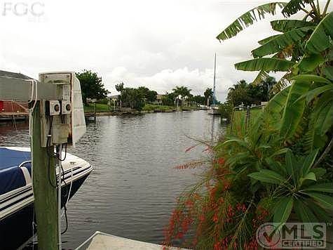 Views looking down the beautiful Gregory Canal behind your home. You can see the nice sized boats down the channel. You have 80' of water frontage with a seawall in place, concrete dock and a boat lift. Your dream has come true! Finally a home you can afford to own and have a boat on your back yard with access to the Gulf of Mexico, what a life it is...live it now...