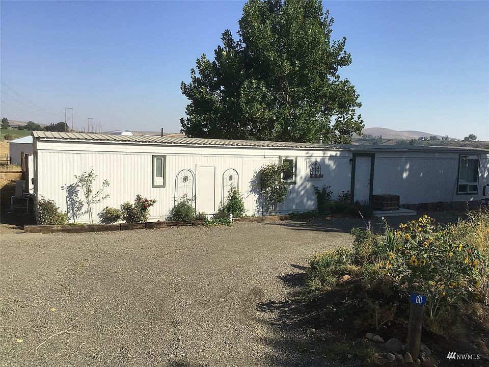 60 Indermuhle Road, a two-bedroom, 1.5 bath home on two irrigated acres perfect for you and your horses.>