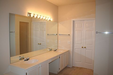 Master bath with dual vanity, water closet, separate tile shower, jetted tub.