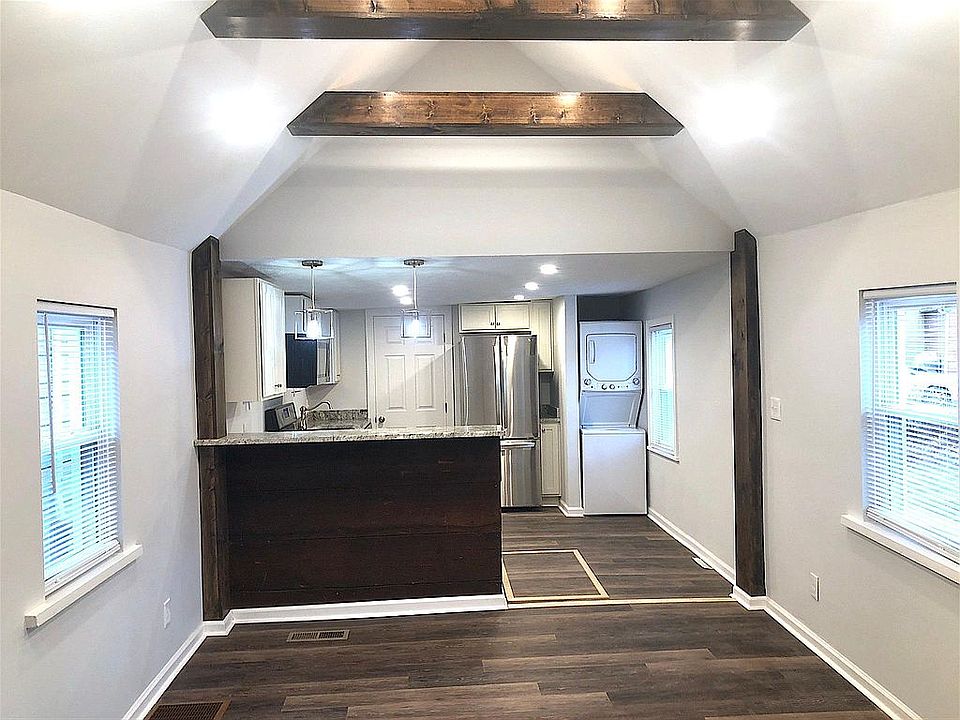 Open concept living & kitchen with bar-top dining All