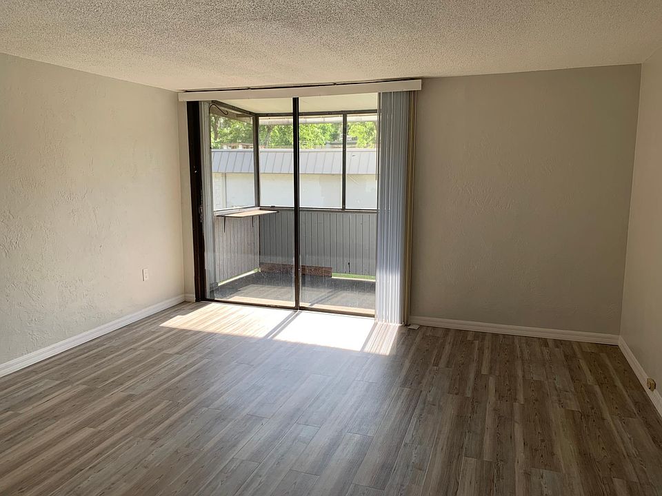 Primary bedroom with screened balcony