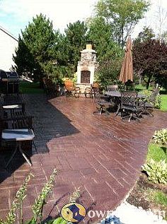 stamped concrete patio with fireplace