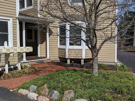 Sidewalk leads to backdoor of apartment