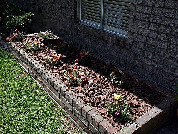 Each side of the entryway is a wonderful flower bed adding wonderful curb appeal.