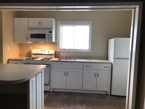 Newly updated kitchen with large island and convection microwave.
