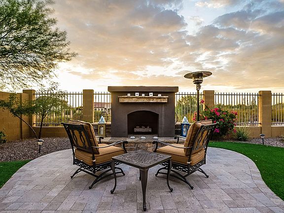 Rear Patio with Fireplace at Dusk