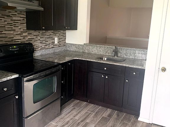 3rd image of 8767 Village Green Ct