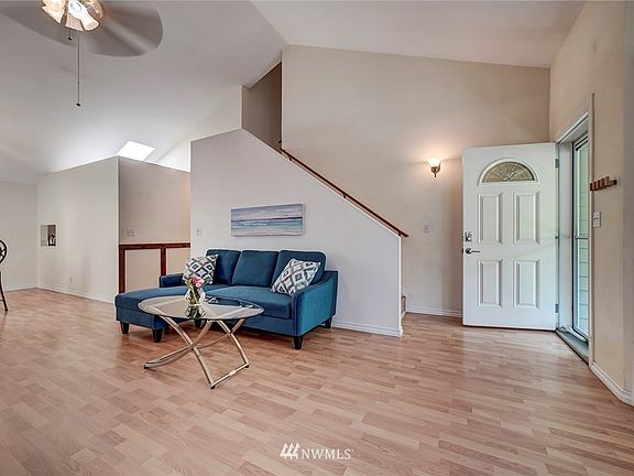 Living room with vaulted ceilings.