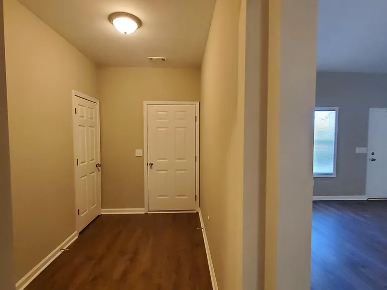 Hallway to Garage and extra storage closet.