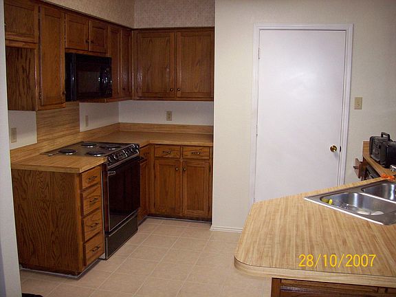 Kitchen - New tile, wall paper, paint, light fixtures 