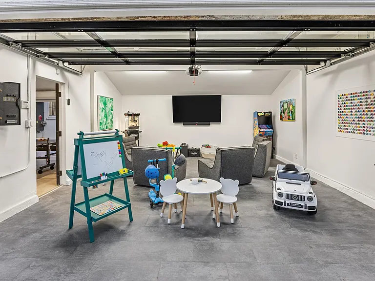 Immerse yourself in the endless fun of the Game Room, a playful haven equipped with modular seating, kids' toys, and a delightful children's table.