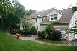 Private backyard, home has elaborate landscaping 
