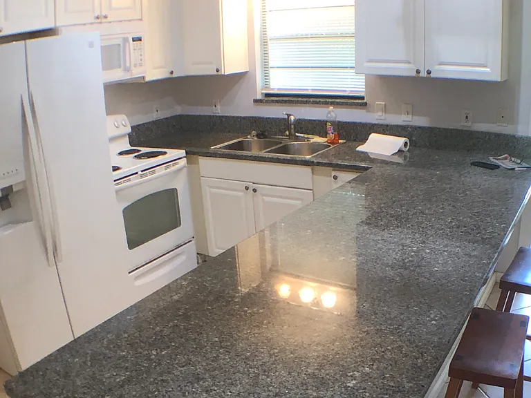 Kitchen with hanger for pots and pans.