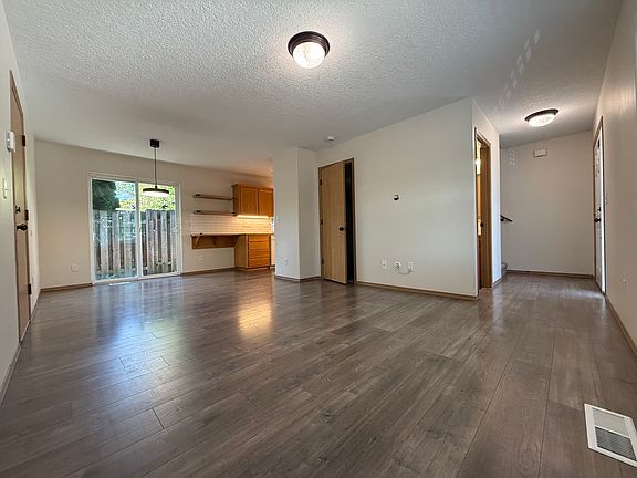 living room, kitchen nook, and front entrance