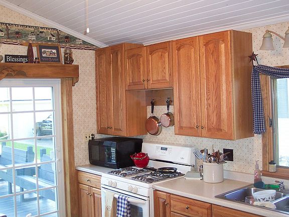 Custom oak kitchen w/slider to rear deck.