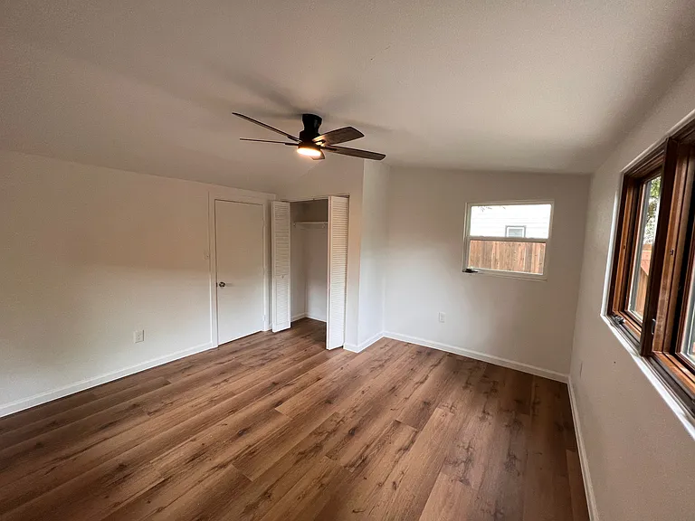 Beautiful fully repainted bedroom with luxury vinyl wood planks.
