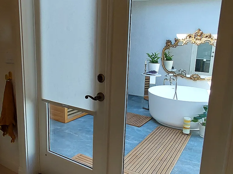 Privacy shades separate the spa courtyard and attached bathroom.