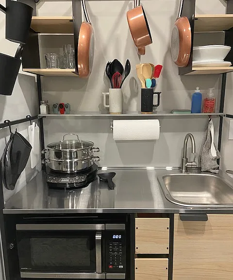 Fully stocked European styled kitchen area.