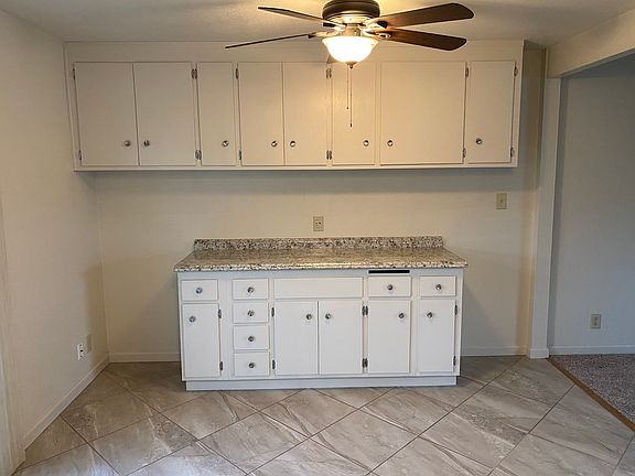 Extra cabinet and countertop space on opposite side of kitchen