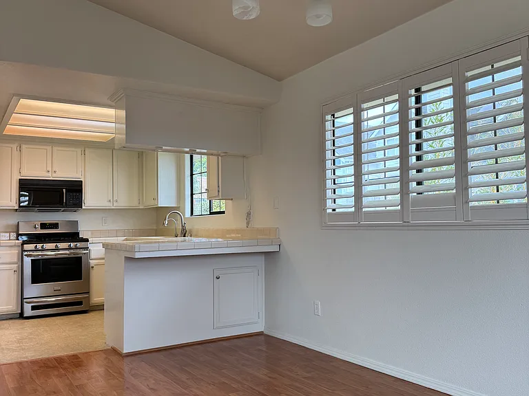 Vaulted Ceiling Dining Room Area into Kitchen
