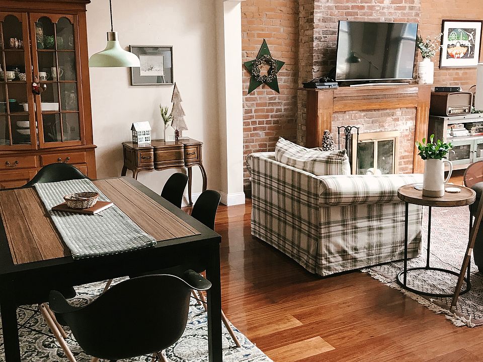 Dining and living area with fireplace