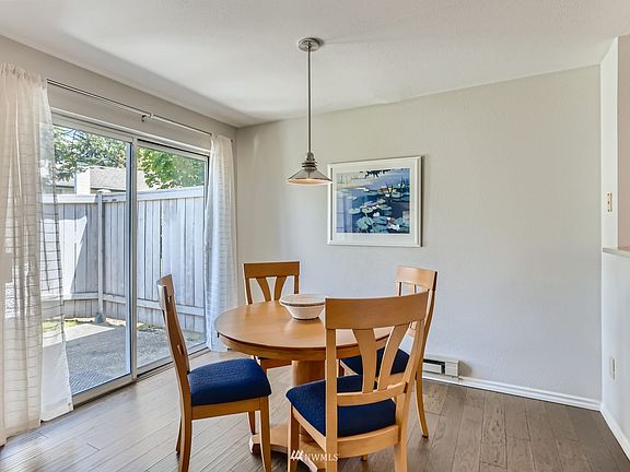 Light & bright dining room with slider to sunny patio and shared yard.