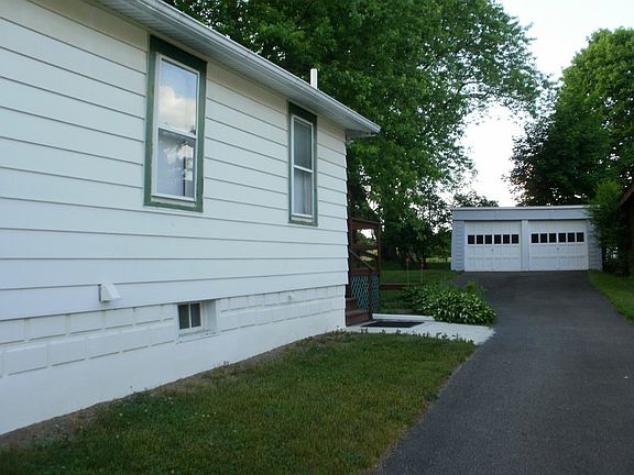 Side View showing Driveway, Side Entrance and Detached Garage