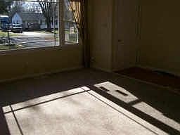 Big picture window in the Living room, new carpet & ceramic tile at entry