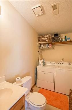 1/2 bath and laundry combined on lower level