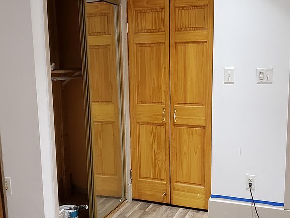 Sliding door closet, and kitchen access door.