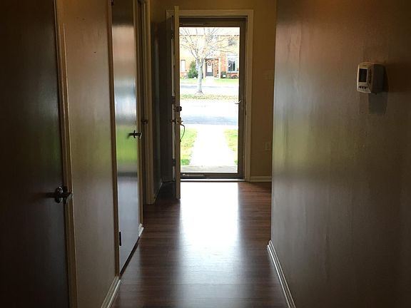 Hallway with hardwood floors