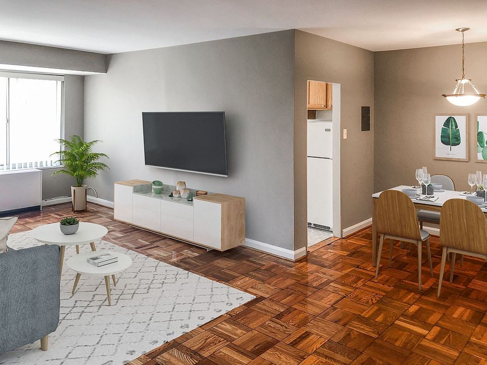 Two-bedroom apartment living and dining area (virtually staged)