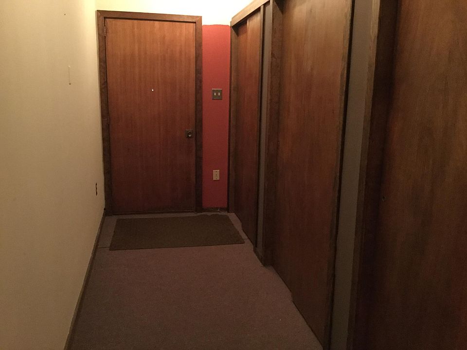 Entry hallway with storage closets
