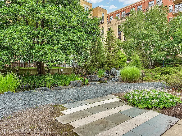 Enjoy the coveted tranquil Block Y courtyard with walking path, benches and serene koi pond