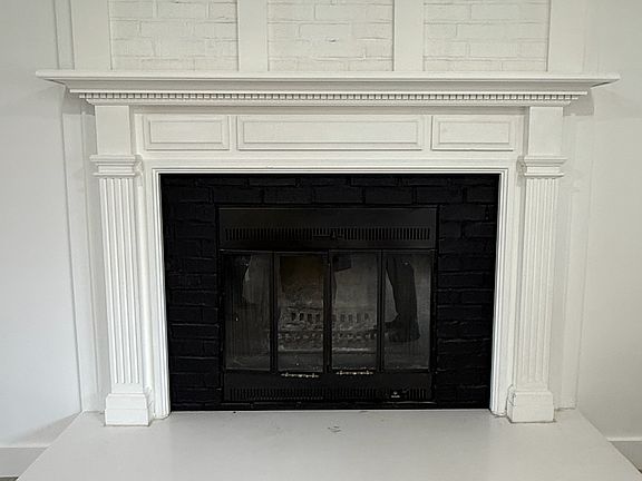 Fireplace mantle ready for your family photos and winter stockings! (Real wood burning)