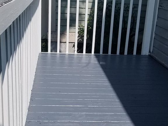 Back deck with a new coat of paint. Space for gardening as well