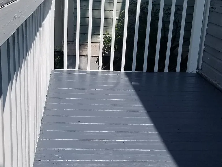 Back deck with a new coat of paint. Space for gardening as well