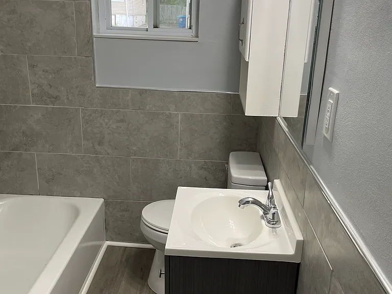 updated bathroom with modern tile