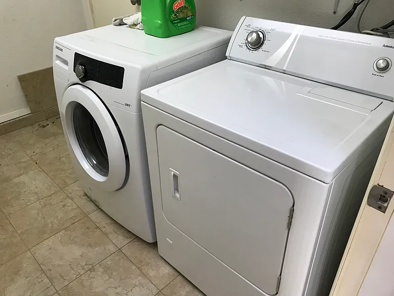 Laundry room accessed from bathroom.
*Machines have been upgraded to new LG HE top loading washer and LG gas dryer.