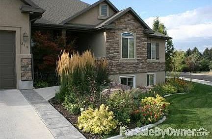 Great curb appeal!
						:
						Beautiful rock and landscaping line the sidewalk to the front porch.