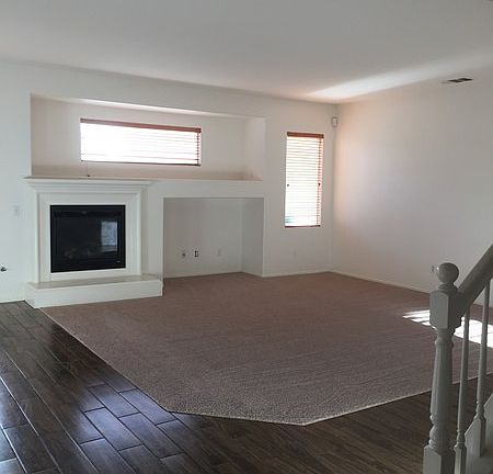 Open Family Room with Fireplace : New Carpet and Wood Plank Tiles