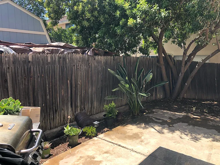 BACKYARD...NEW WOOD FENCES TO BE INSTALLED WITHIN THE NEXT WEEK