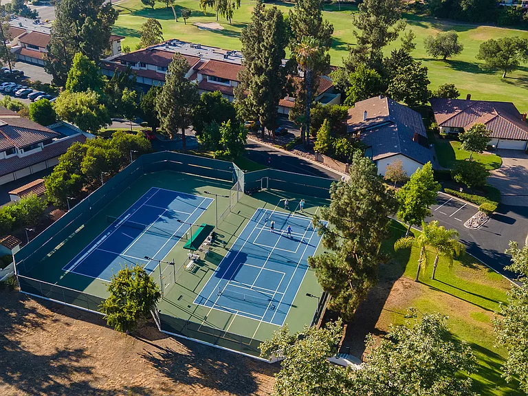 Residents enjoy access to a swimming pool and spa, pickleball and tennis courts, lawn bowling, fitness center, library, pottery studio, card rooms, numerous clubs and social activities, walking and hiking groups, and the nearby Oaks North Golf Course.