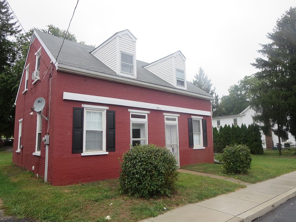 There are 2 front doors -- one enters the laundry and one enters the living room.