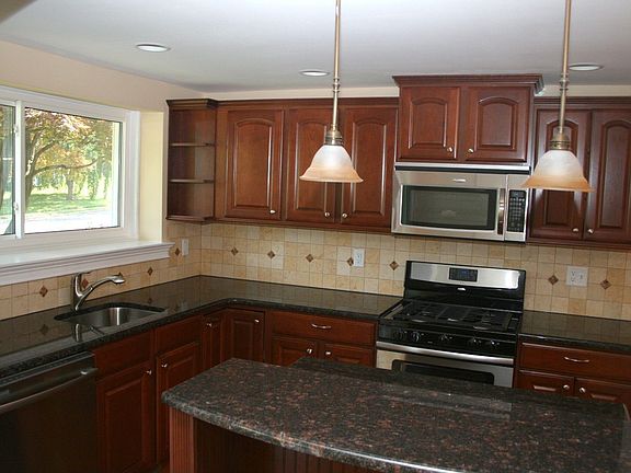 Cherry Cabinets -Granite Tops