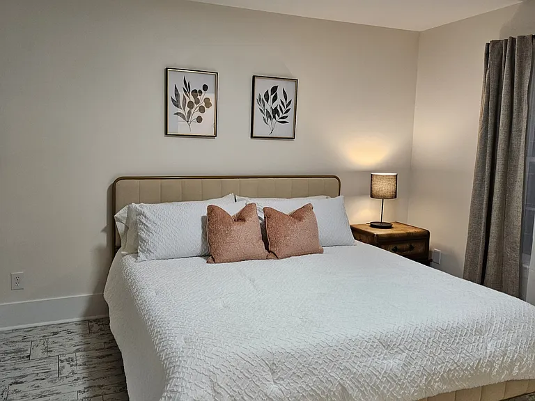 Primary Bedroom w/ King Size Bed and In suite bathroom